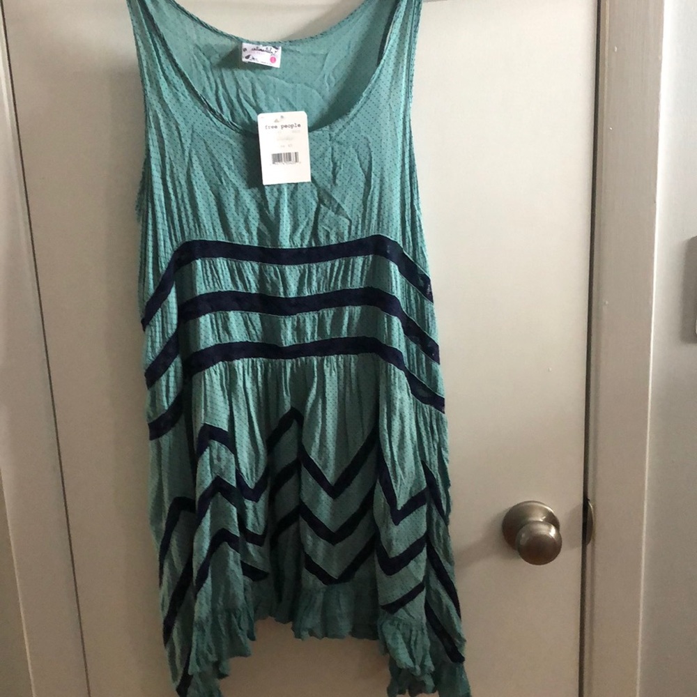 NWT free people slip tunic dress. It is greenish blue with blue dots and lace.